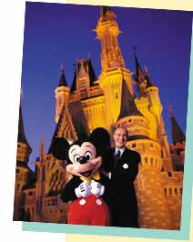George Aguel, Senior Vice President & General Manager, Disney Vacation Development, Inc. with Mickey Mouse at the  WALT DISNEY WORLD Resort 